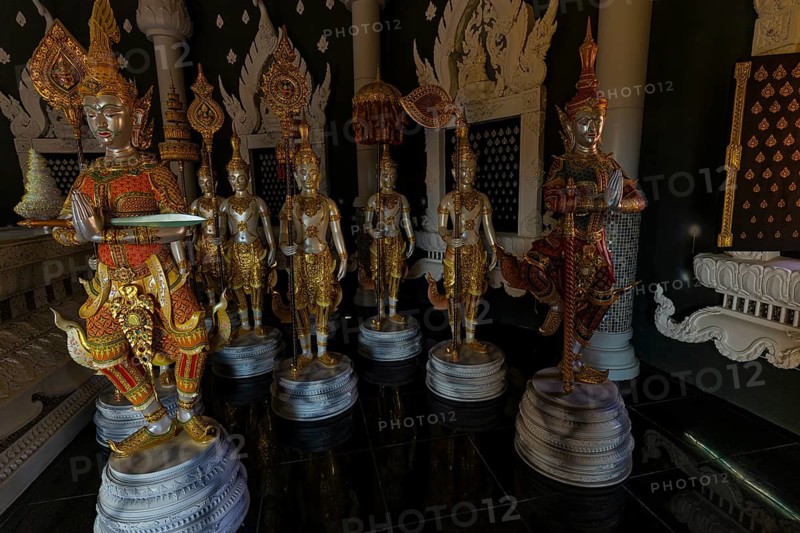 Figures as heavenly beings and temple guards in the public prayer hall in the Buddhist temple complex Wat Phra That Don Phra Chan, near Lampang, Lampang Province, Thailand