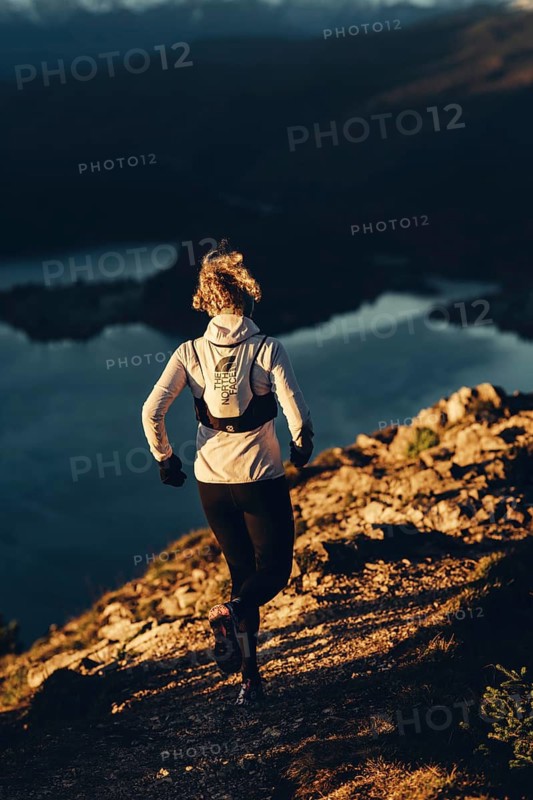 Trail running in autumn on the Jochberg on Lake Walchensee against the wonderful backdrop of the Alps, Bavaria, Germany