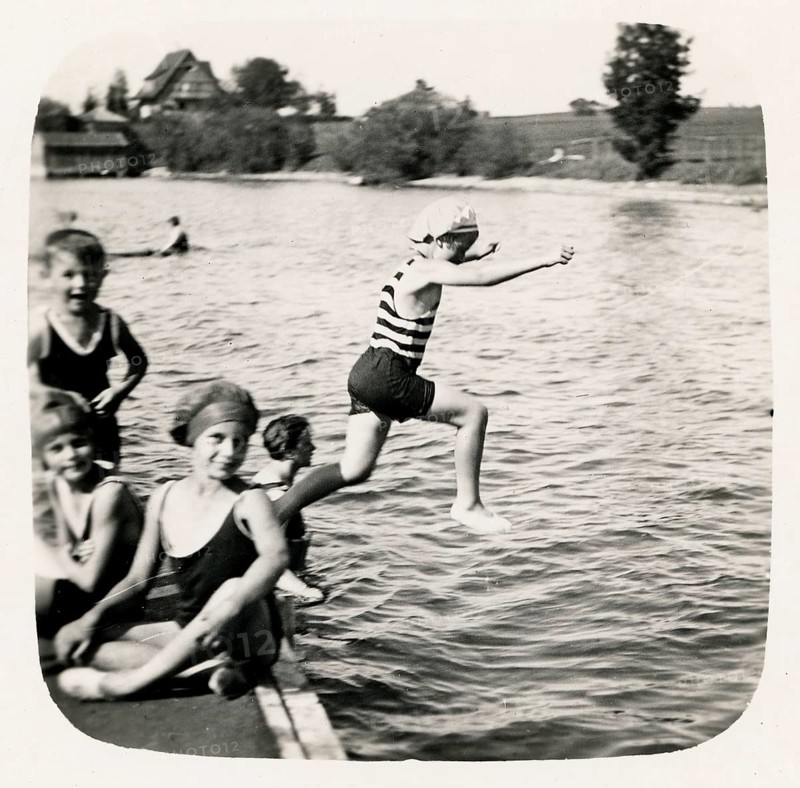 Bathing, swimwear, leisure, summer, girls, boys, children, child jumping into a river, accompanied by other children on the shore, lake, around 1925