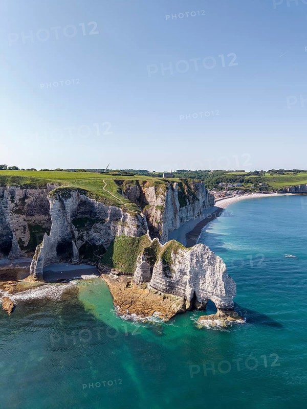 Aerial view of the Falaise d'Amont rock formation with the Porte d'Amont rock gate at low tide, Étretat, Alabaster Coast, La Côte d'Albâtre, chalk cliffs, English Channel, Seine-Maritime, Normandy, France