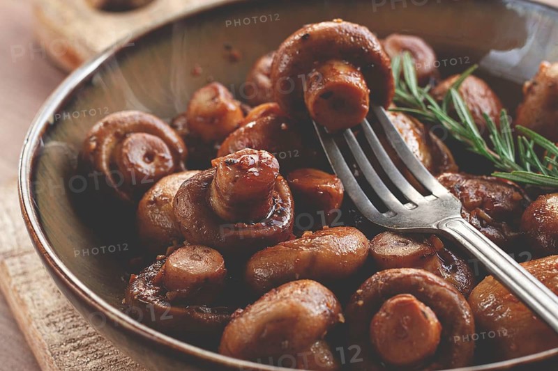 Fried mushrooms, with spices, in soy sauce, vegetarian food, homemade, no people