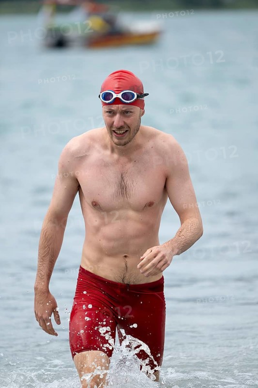 Swimmer comes out of the water after the swimming stage, Tegernsee Triathlon, Tegernsee, Upper Bavaria, Bavaria, Germany