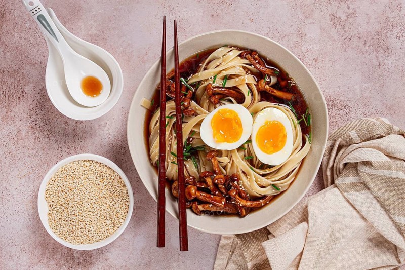 Buckwheat noodles soba with shimeji mushrooms, with boiled egg, green onion, sesame seeds, homemade, without people