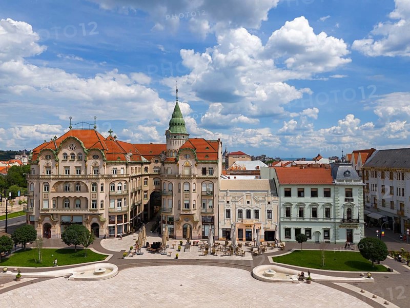 Baroque series of buildings with green dome and red roofs surrounding a square in a city, aerial view, Palace of the Black Eagle, Piata Unirii, Unity Square, Oradea, Oradea, Bihor District, Kreischland, Transylvania, Romania