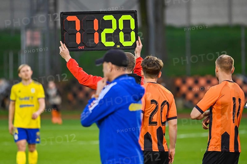 Man shows players substitution during football match in Glogow, Poland