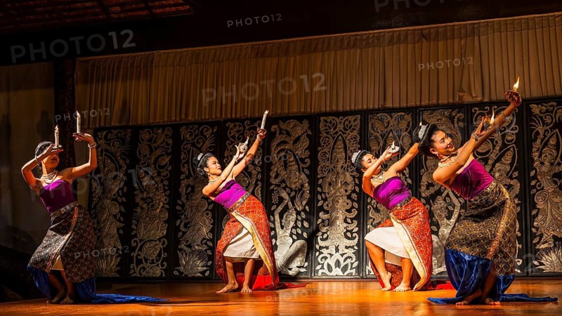 Young Thai women in traditional dress showing a traditional dance, Old Chiang Mai Cultural Center, Chiang Mai, Thailand