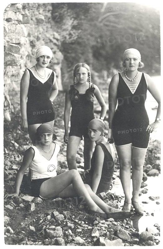 Bathing, swimwear, woman, girls, children, leisure, fun, summer, Five woman wearing swimsuits and standing on a gravelly beach in front of a stone wall, July 1927