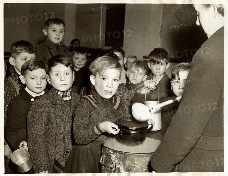 Berlin, end of war, soup kitchen for children, parentless, orphans, boys, refugees, children in a soup kitchen standing in line to receive food, around 1946