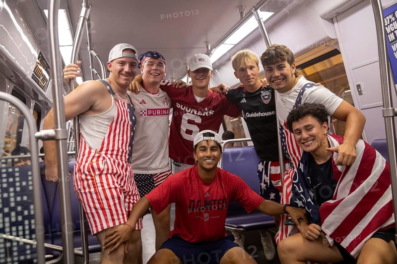 Washington, DC - Young men from Virginia pose for a picture on the Washington Metro on their way to the Great American State Fair