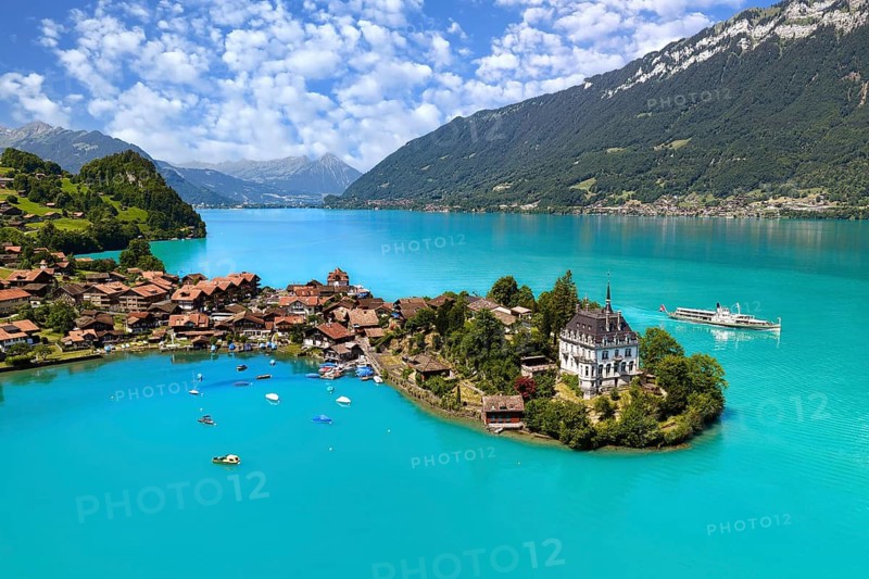 View of Iseltwald from above, peninsula in Lake Brienz with steamboat, Canton of Bern, Switzerland