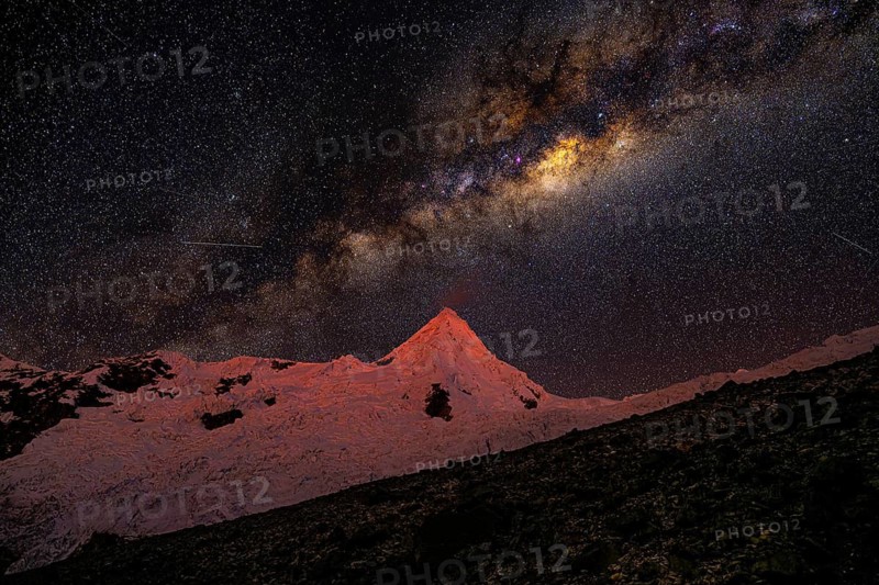 The Milky Way above Alpamayo with Alpamayo Glacier, 5947 m, with the title of most beautiful mountain in the world, Cordillera Blanca, Huascaran National Park, northern Peru, Peru, South America