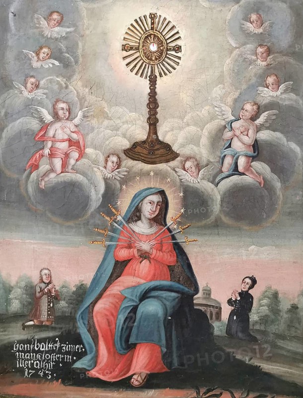 Votive image from the 18th century in the monastery church, Mönchsdeggingen monastery, former monastery of the Mariannhill missionaries, near Nördlingen on the southern edge of Riesrand, Donau-Ries district, Swabia, Bavaria, Germany. Depiction of Mary as Mother of Sorrows, Mater Dolorosa, whose heart is pierced by seven swords, symbolizing the seven pains of Mary, exaggerated by a monstrance representing the Eucharistic bread, and flanked by angels on clouds and two kneeling donors at the bottom left and right