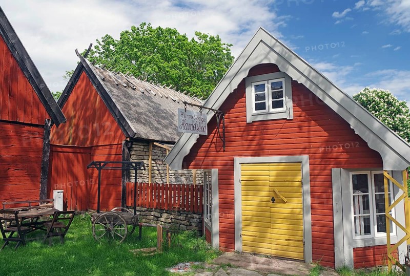 Traditional red houses in an idyllic rural setting under blue skies, museum, Himmelsberga, Öland, Sweden