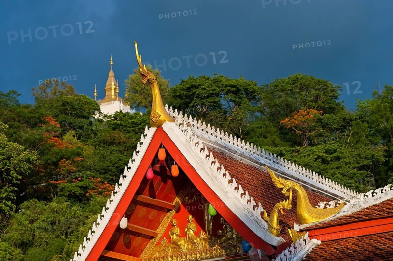 Mt Pousi (Phousi Hill), the local landmark of Luang Prabang, with its golden stupa and ornate Laotian roof, Buddhist temple and monastery, Wat May Souvannapoumaram, Luang Prabang, Laos, South-East Asia