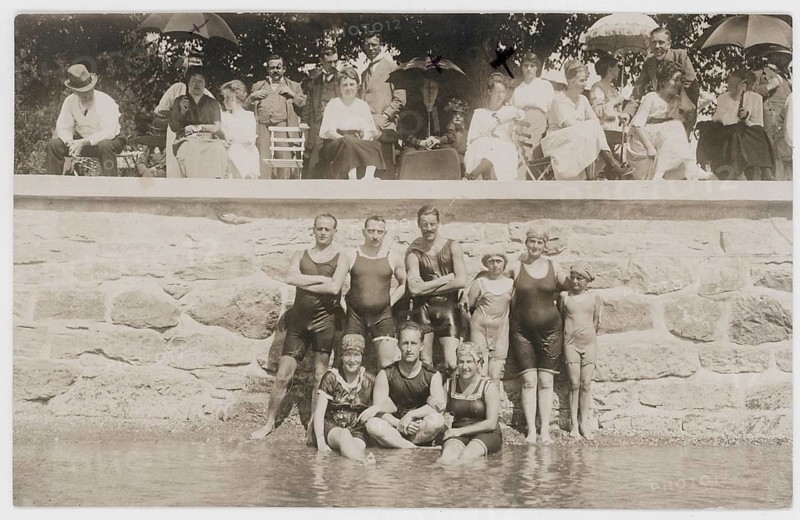 Bathing, swimwear, leisure, summer, swimming, woman, men, river, group of people in bathing suits in front of a stone wall, spectators behind them, around 1926