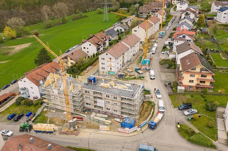 Residential street with active construction sites and cranes along the road, residential renovation, Nagold, Calw district, Germany