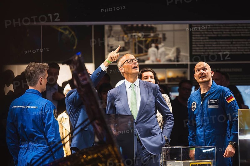 Friedrich Merz and Alexander Gerst during the Chancellor's tour of the ILA (International Aerospace Exhibition) on 10 June 2026 at the Berlin-Schönefeld Exhibition Grounds