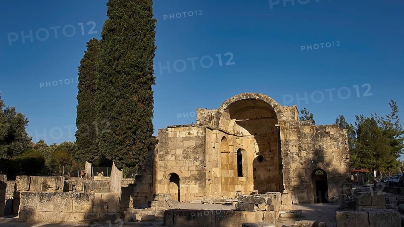 Titus Basilica, Greece, ancient ruin with cypress tree in the background under clear sky, Gortyn, Gortyna, Gortys, ancient city in central southern Crete, later capital of the Roman province of Creta, Crete, Greek islands, Greece