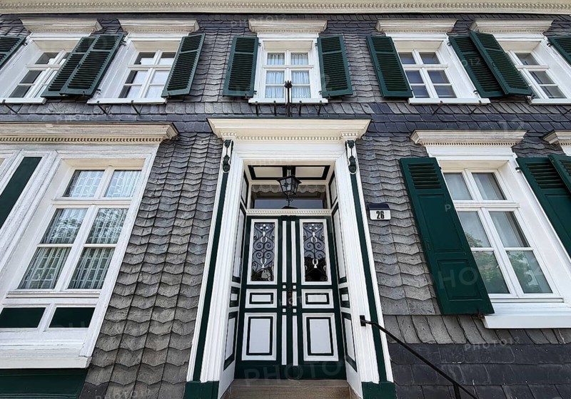 Beautiful front door with slate façade and green shutters, Bergischer Dreiklang, Hückeswagen, Bergisches Land, Germany