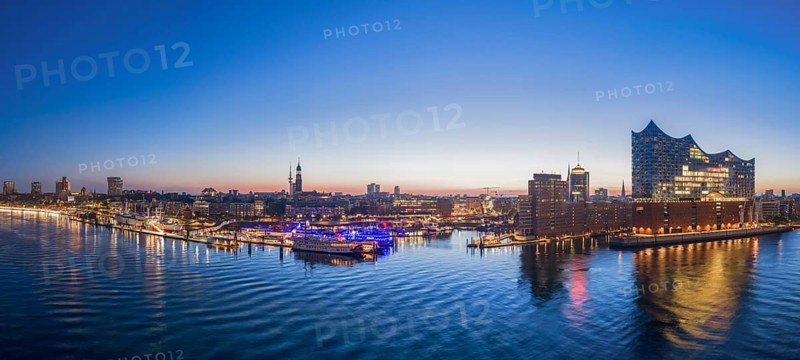 Panorama aerial view of Landungsbrücken (Jan-Fedder-Promenade) at sunrise on the Elbe with Elbe Philharmonic Hall, Hamburg, Germany