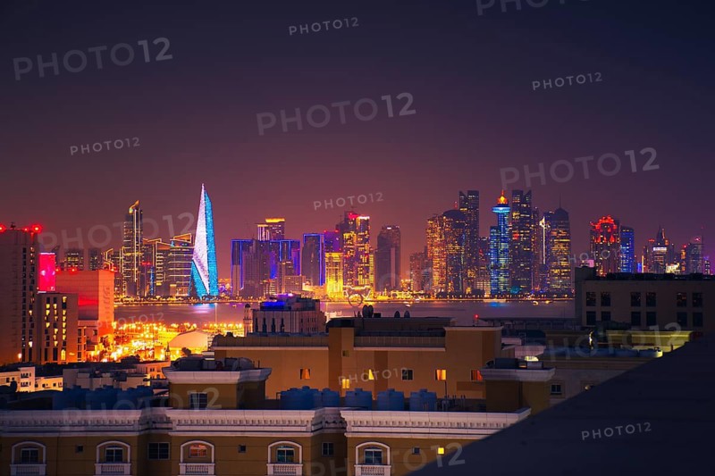 Doha, Qatar - january 8th, 2026: residential area and Doha business hub skyline at night. Iconic illuminated skyscrapers business district luxury middle east gulf colorful night architecture