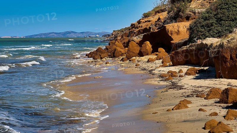 Vulcanic Beach, natural rocky coast with sea and waves, blue sky in the background, Kos, Dodecanese, Greek Islands, Greece