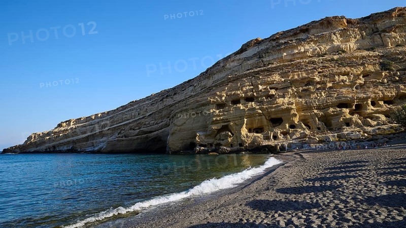 Neolithic caves, former hippie paradise, coast with distinctive rock formations and calm blue sea, Matala, south coast, Crete, Greek Islands, Greece