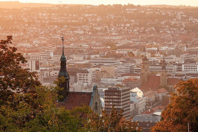 30.09.2018: Stuttgart city panorama at sunset with Collegiate Church and St. Leonhard Church towers. Stuttgart, Baden-Württemberg, Germany