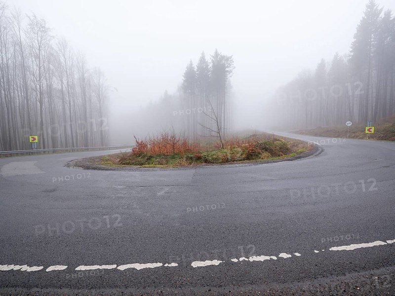 Sweeping a mountain pass in fog, Maramures, Romania