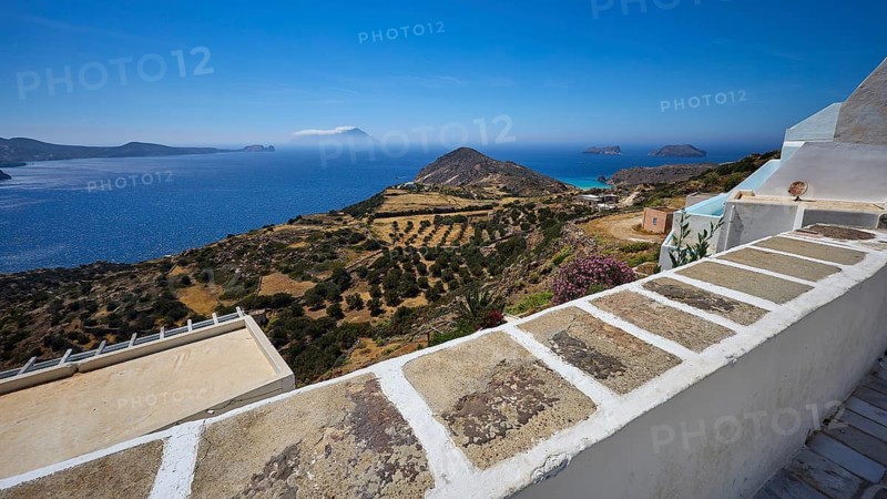 Church, Panagia Corfiatissa, view over olive groves to the coast, panorama under clear sky, Plaka, main town on Milos, island of Milos, volcanic island, Cyclades, Greek islands, Greece