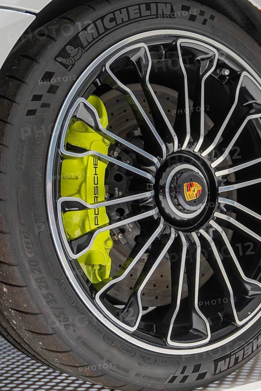 Close-up of a Porsche wheel with green brake, Porsche Museum, Stuttgart, Germany