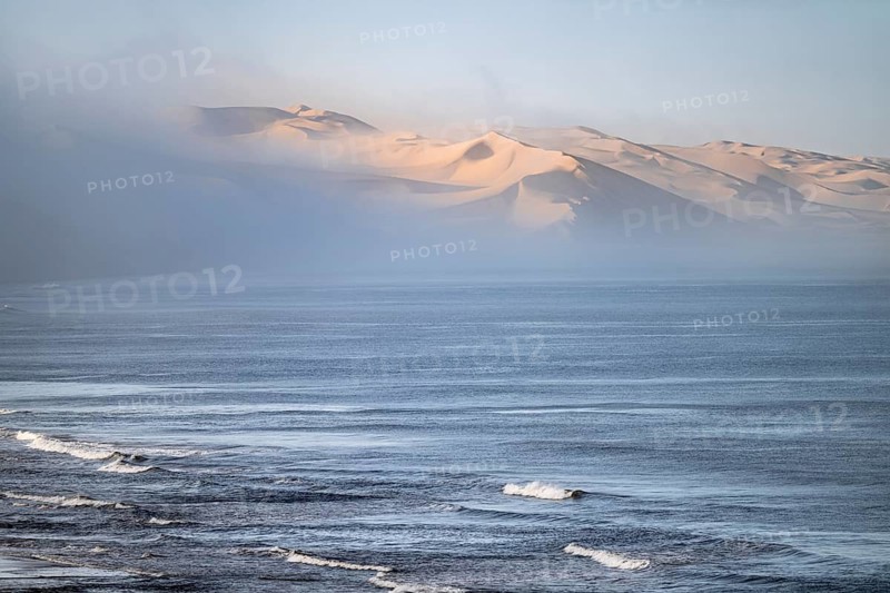 Atlantic coast, sea and sea fog in the morning, dunes of the Namib Desert, impressive desert landscape, Namib Naukluft Park, Namibia