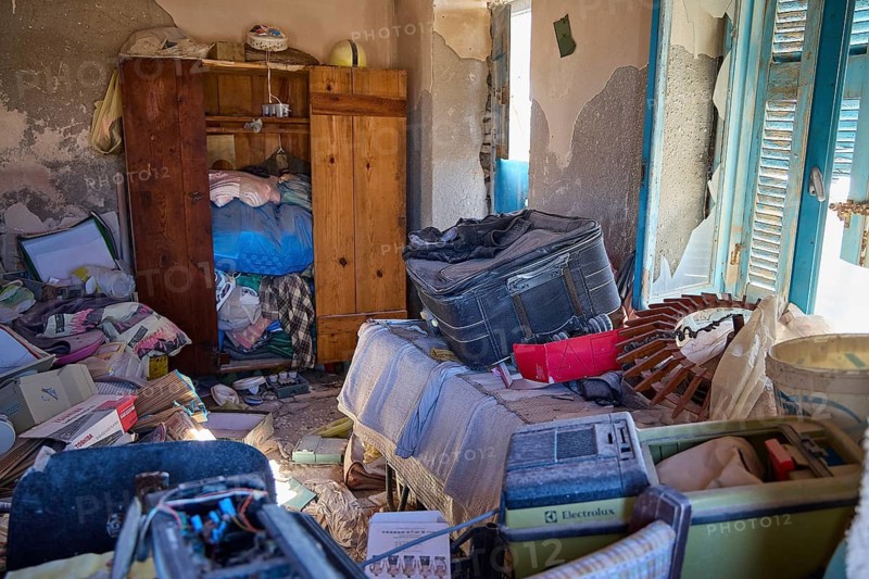 A neglected room with broken walls and a variety of old, jumbled objects, saltworks, lost place, near airport, salt lake, Alykes Milou, Milos, Cyclades, Greek Islands, Greece