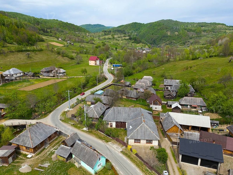 Rural village view with roads and traditional houses in a hilly green landscape, aerial view, Slatioara, Slatioara, Maramure?, Maramures, Maramuresh region, Romania