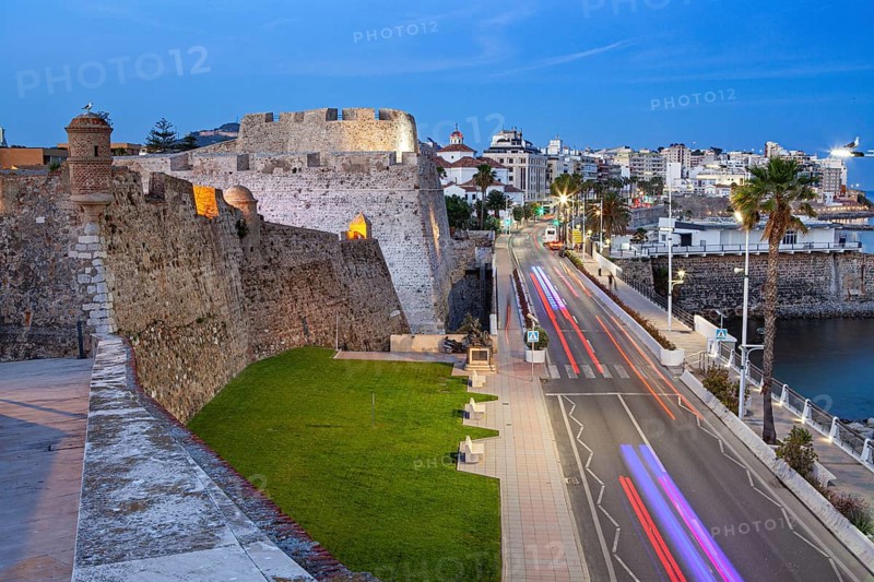 The Royal walls and bastions with a night view of the city of Ceuta, Spain, North Africa