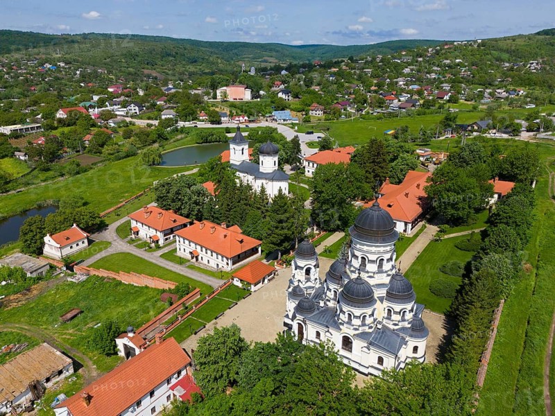 Aerial view of a monastery with Orthodox churches in a green landscape surrounded by forests, aerial view, Capriana monastery, Capriana, Stra?eni district, Straseni, Republic of Moldova, Moldova
