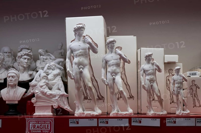 Statues of David by Michelangelo in various sizes for tourists as souvenirs, Florence, Tuscany, Italy