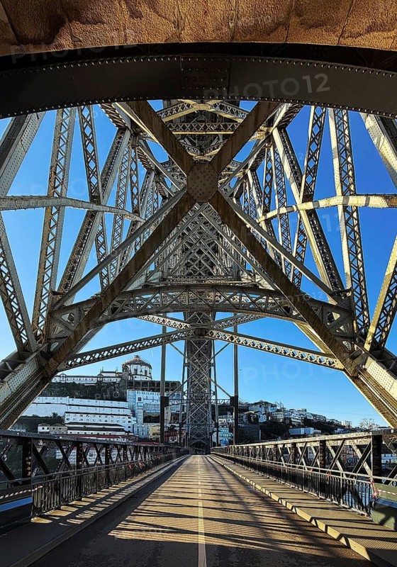 Ponte Dom Luis I arched bridge designed by Théophile Seyrig, looking up from the lower level towards Vila Nova de Gaia, Porto, Portugal
