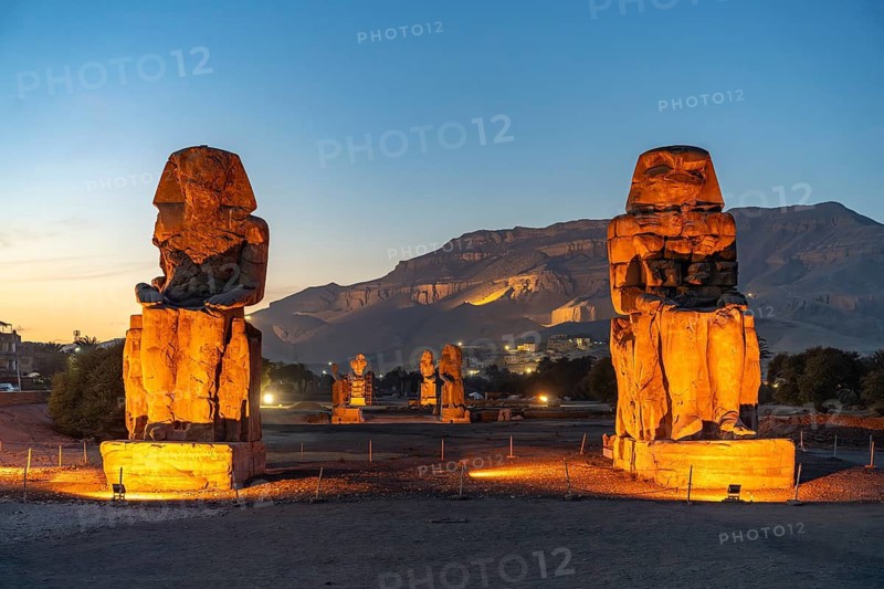 The Colossi of Memnon in the Nile Valley in West Thebes near Luxor at dusk, Egypt