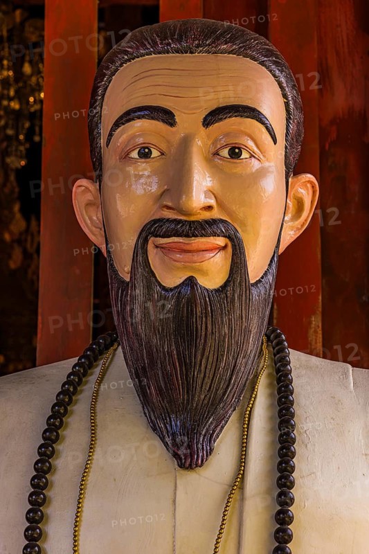 Colored wooden sculpture of Confucius, Wat Phra Singh Buddhist temple complex, Chiang Mai Old City Center, Chiang Mai Province, Thailand