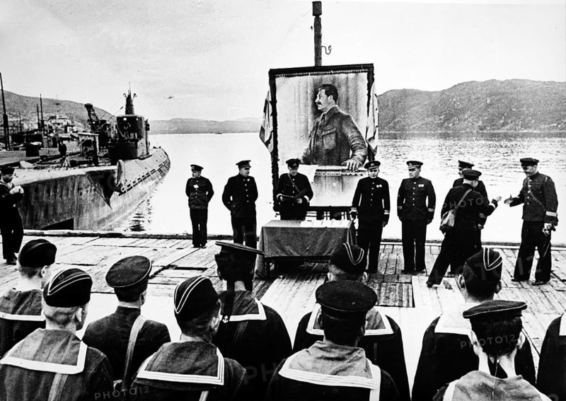 Red Army men, speech in front of a portrait of Joseph Stalin, Northern Front, Murmansk, Soviet Union, 1941