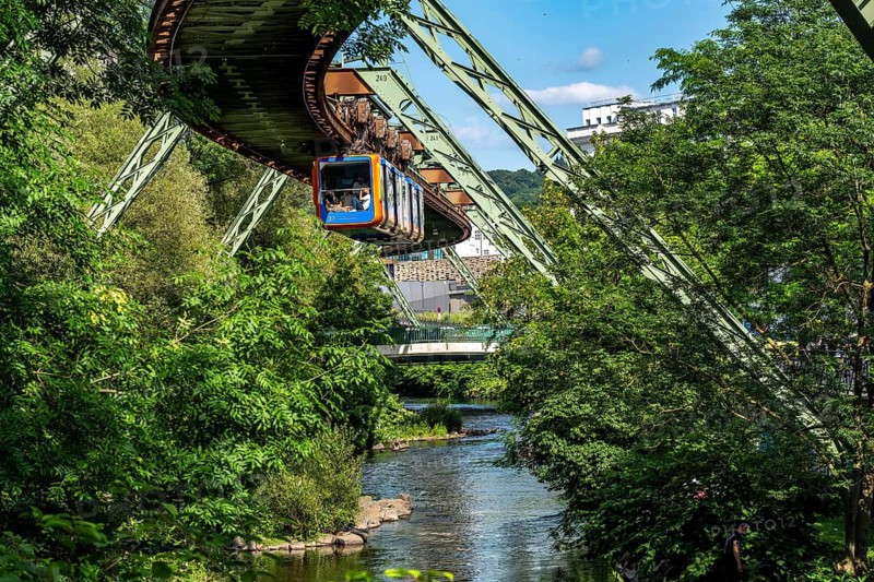 The Wuppertal suspension railway runs above along the Wupper River, between the central railway station stop and Ohligsmühle, Germany
