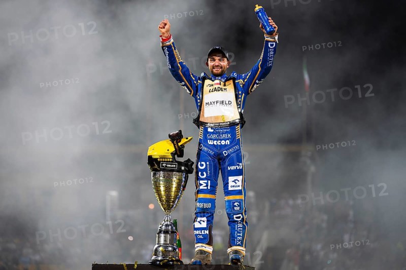 WROCLAW, POLAND - JUNE 20, 2026: DEWALT FIM Speedway GP of Poland. Speedway rider celebrating victory with trophy after race. Joy winner Bartosz Zmarzlik
