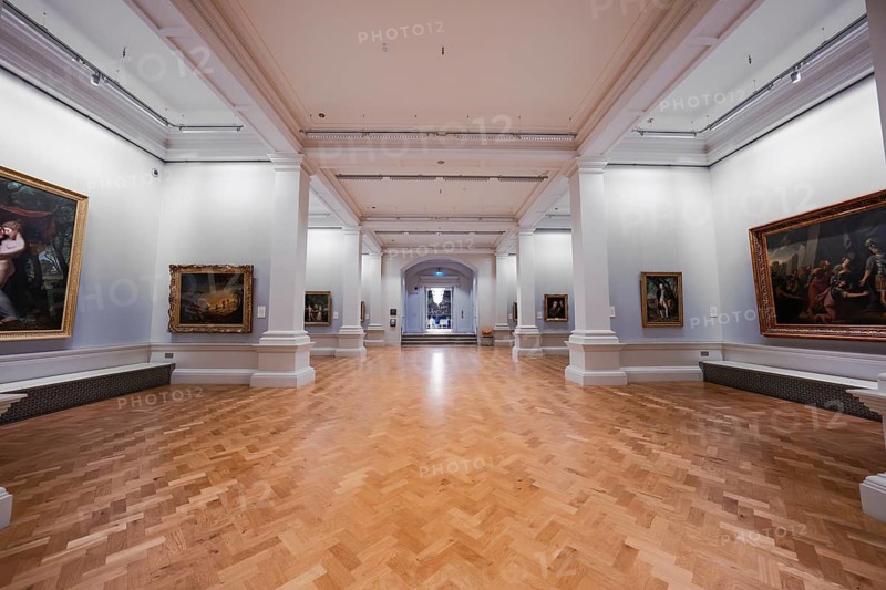 A gallery space with historic paintings on white walls, parquet floors and high ceilings, National Gallery of Ireland, Dublin, Ireland