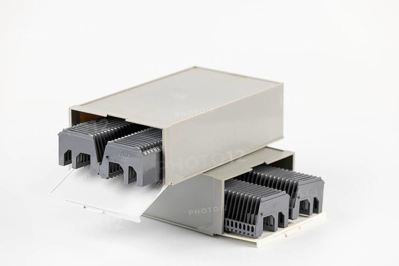 Two gray boxes stacked on top of each other for slides with magazines