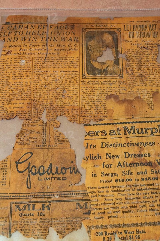 Old yellowed newspaper page with advertisements from The Montreal Daily Star October 19, 1917 edition in archival safe protective polyethylene page, Studio Composition, Quebec, Canada