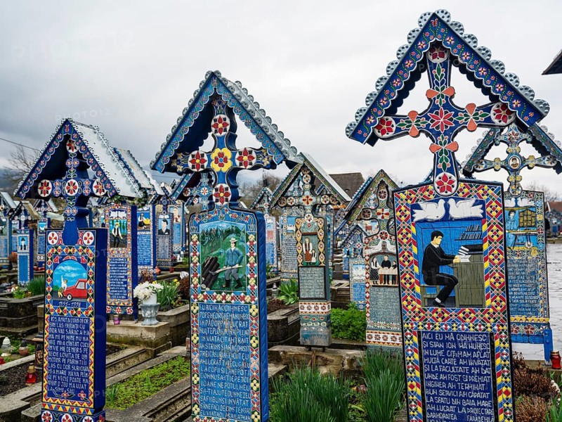 Colourfully painted wooden crosses in the cheerful Cimitirul Vesel cemetery, Sapân?a, Maramure?, Romania