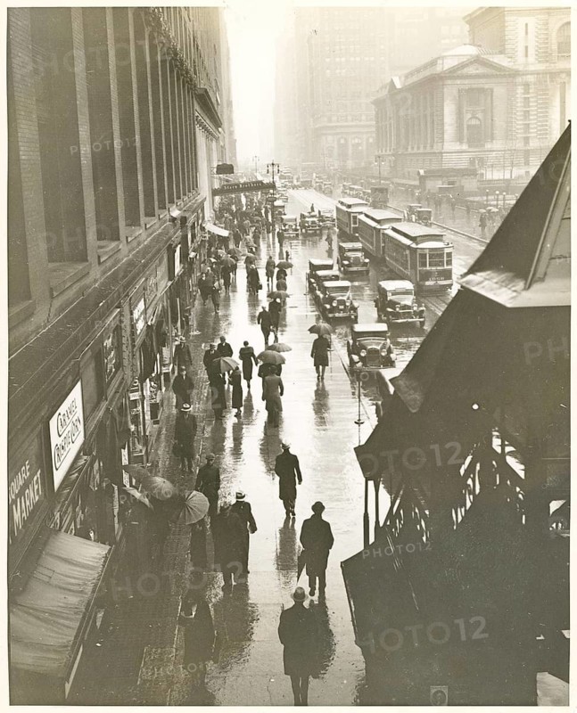 New York, 42nd Street, rain, traffic, streetcar, shops, department stores, Stern Brothers, Manhattan, USA, pedestrians under umbrellas walking along a rainy urban street, around 1935
