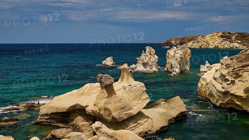Rough rocks by the sea with deep shades of blue and dramatic scenery, Aspragremna, White Cliffs, Mavorspilia Beach, Kimolos Island, Kimolos, Cyclades, Greek Islands, Greece