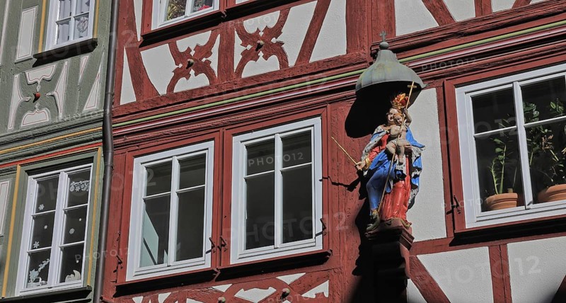 Historic old town, figure of a saint on a half-timbered house, Miltenberg, Lower Franconia, Bavaria, Germany
